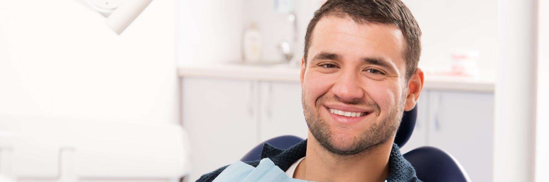 patient smiling after full smile makeover in McCrae