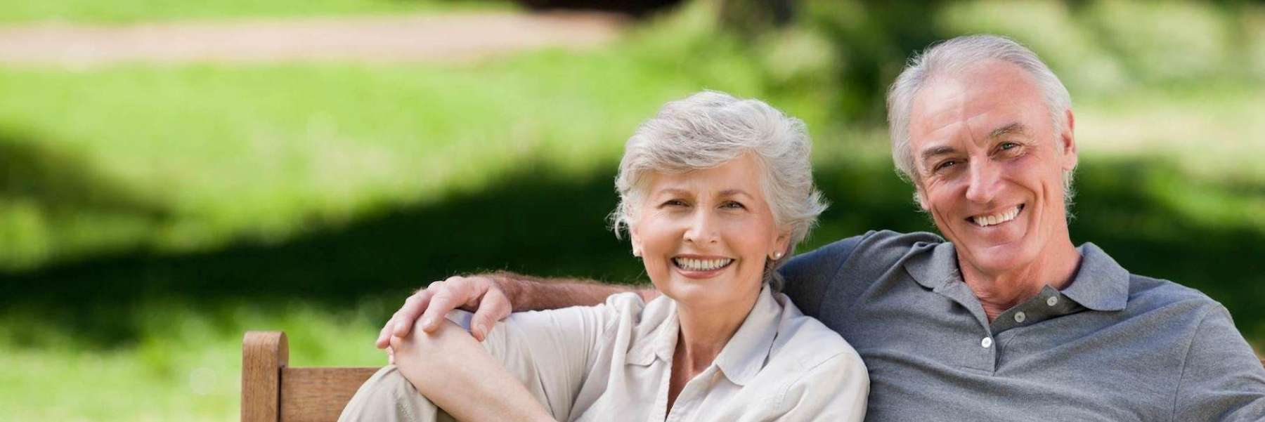 older couple on bench | dentist mccrae