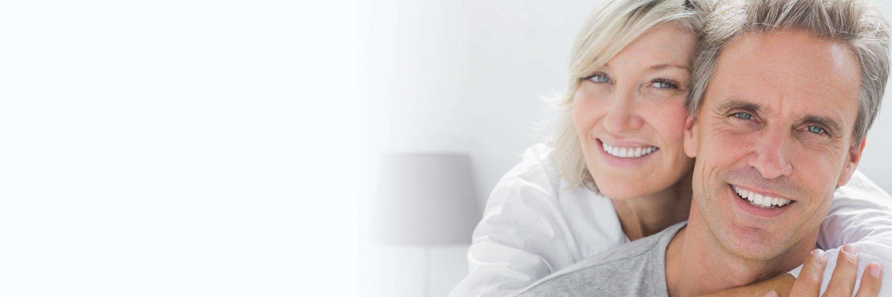 couple smiling | Mccrae dental crowns