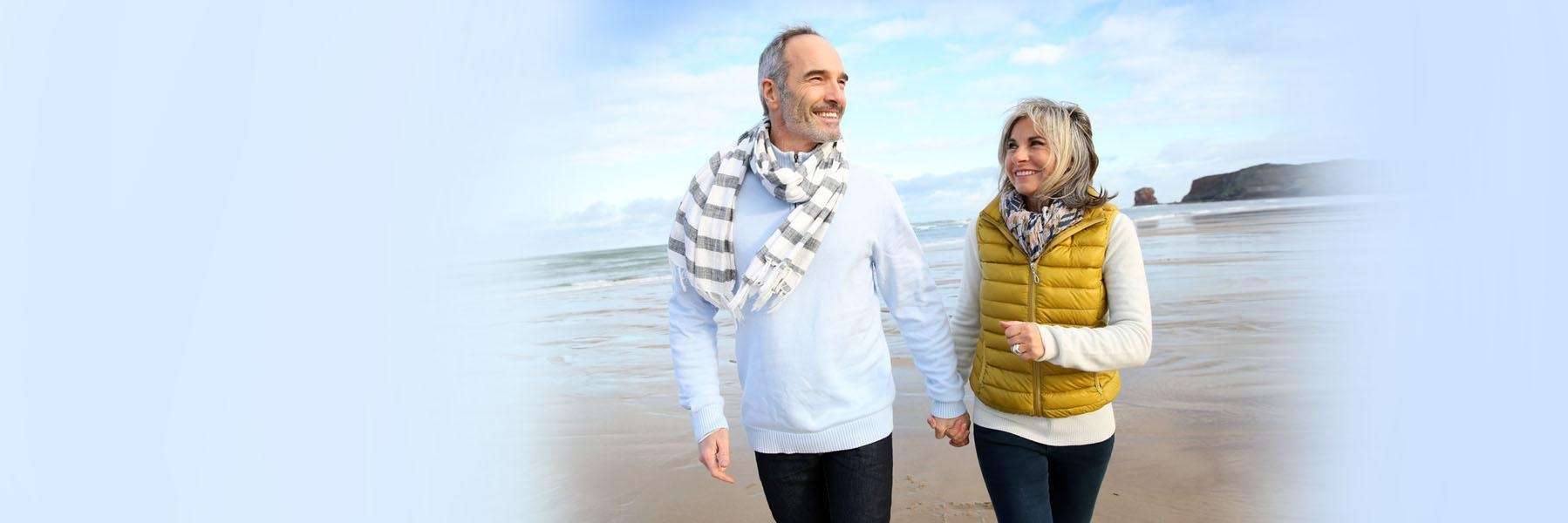 couple walking on the beach in McCrae