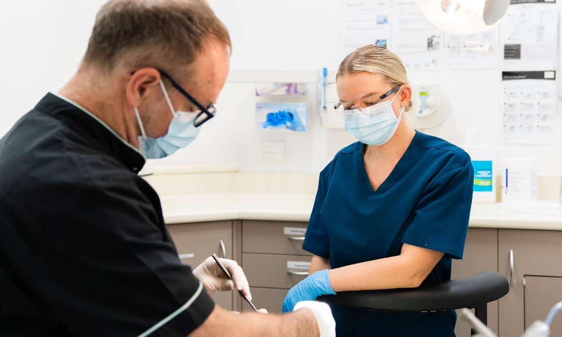 dentists completing exam | dental cleans mcCrae