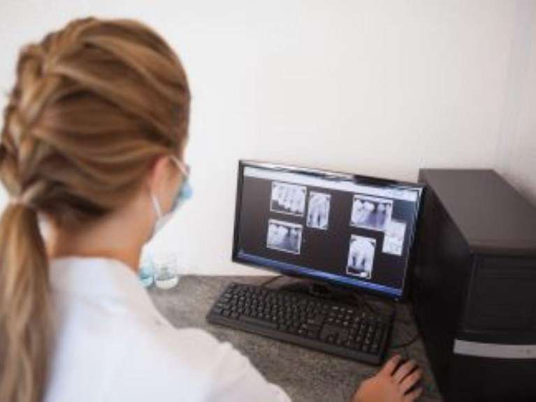 dentist in mccrae looking at patient's x-rays