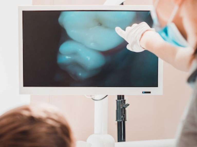 dentist in mccrae looking at a patient's images taken with an intraoral camera